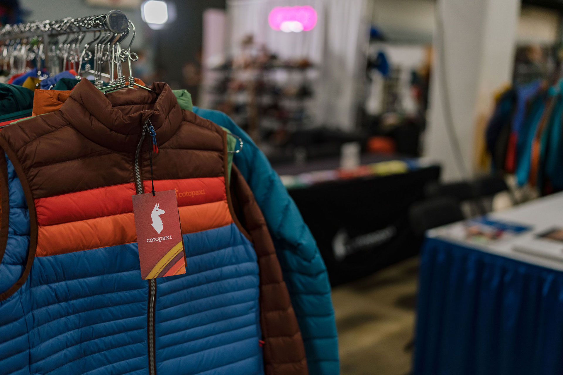 Cotopaxi jacket hanging on a rack