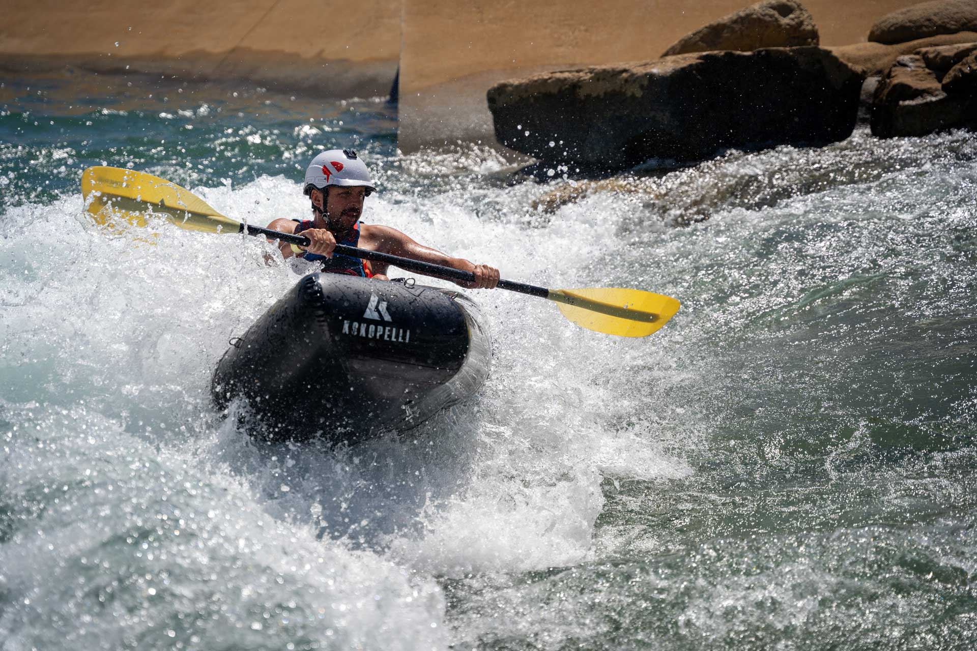 Man rides water rapids