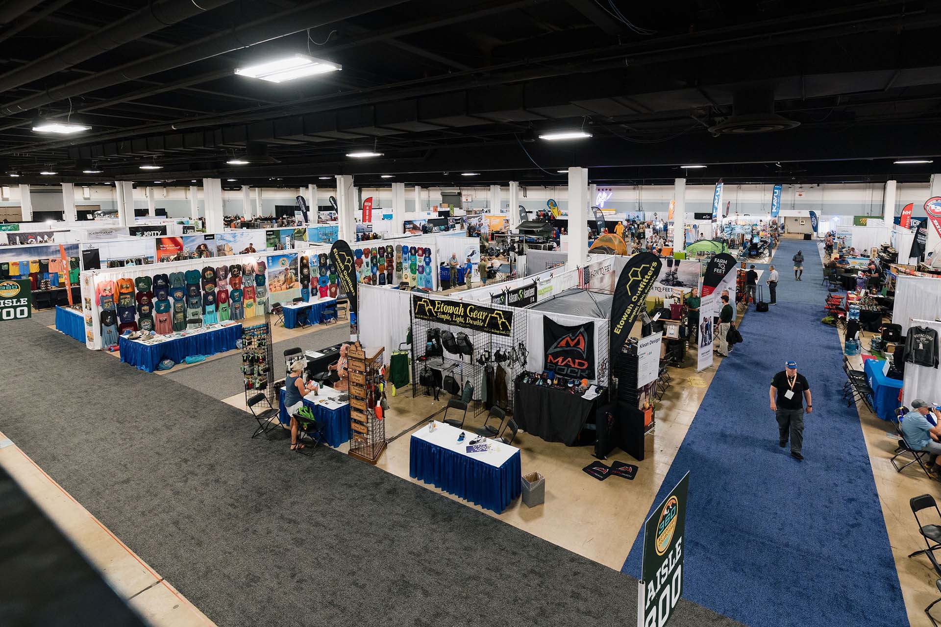 rows of booths at an outdoor gear expo